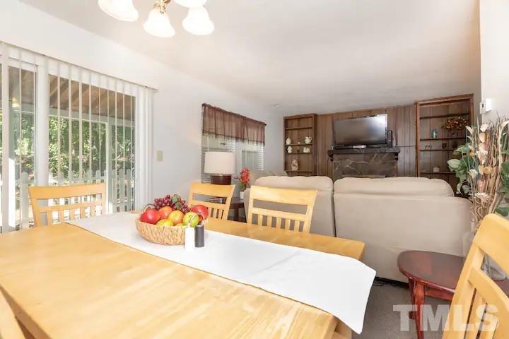 700 Godwin Court Raleigh, NC 27606 - Photo 6 of 20 a bedroom with furniture and a large window