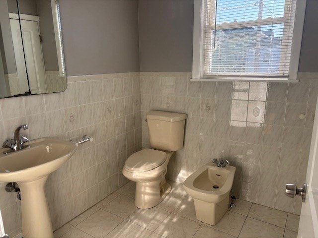 193 Snell Street, Unit 2 Fall River, MA 02721 - Photo 13 of 19 a bathroom with a toilet sink and mirror