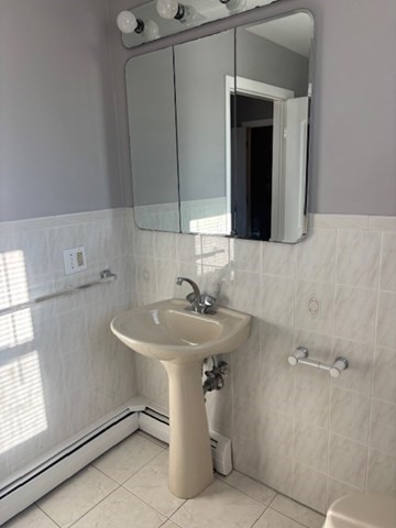 193 Snell Street, Unit 2 Fall River, MA 02721 - Photo 14 of 19 a bathroom with a sink and a mirror