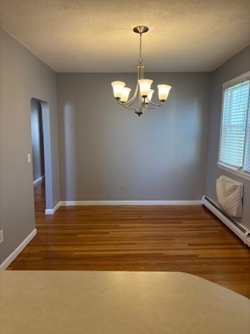 193 Snell Street, Unit 2 Fall River, MA 02721 - Photo 3 of 19 a view of empty room with wooden floor