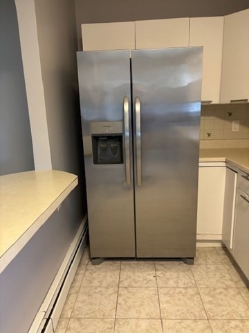 193 Snell Street, Unit 2 Fall River, MA 02721 - Photo 9 of 19 a room with a refrigerator and cabinets