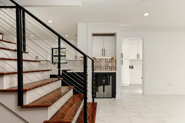 a kitchen with a sink dishwasher a stove and a refrigerator