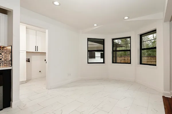 a kitchen with a sink a stove and cabinets