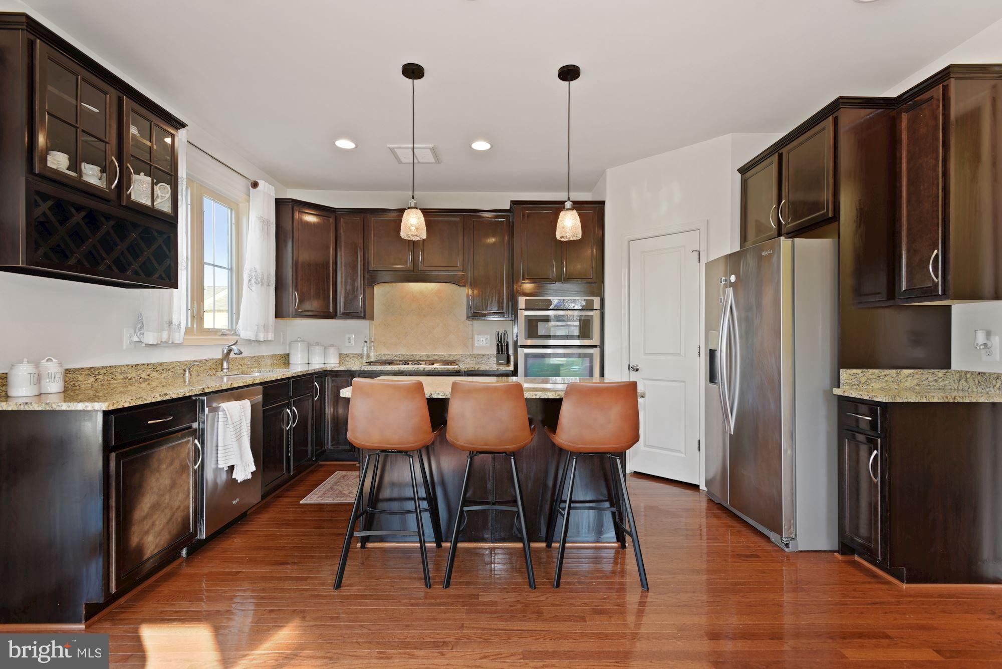42186 Castle Ridge Square Brambleton, VA 20148 - Photo 11 of 37 Gorgeous kitchen w/ island & granite counters!