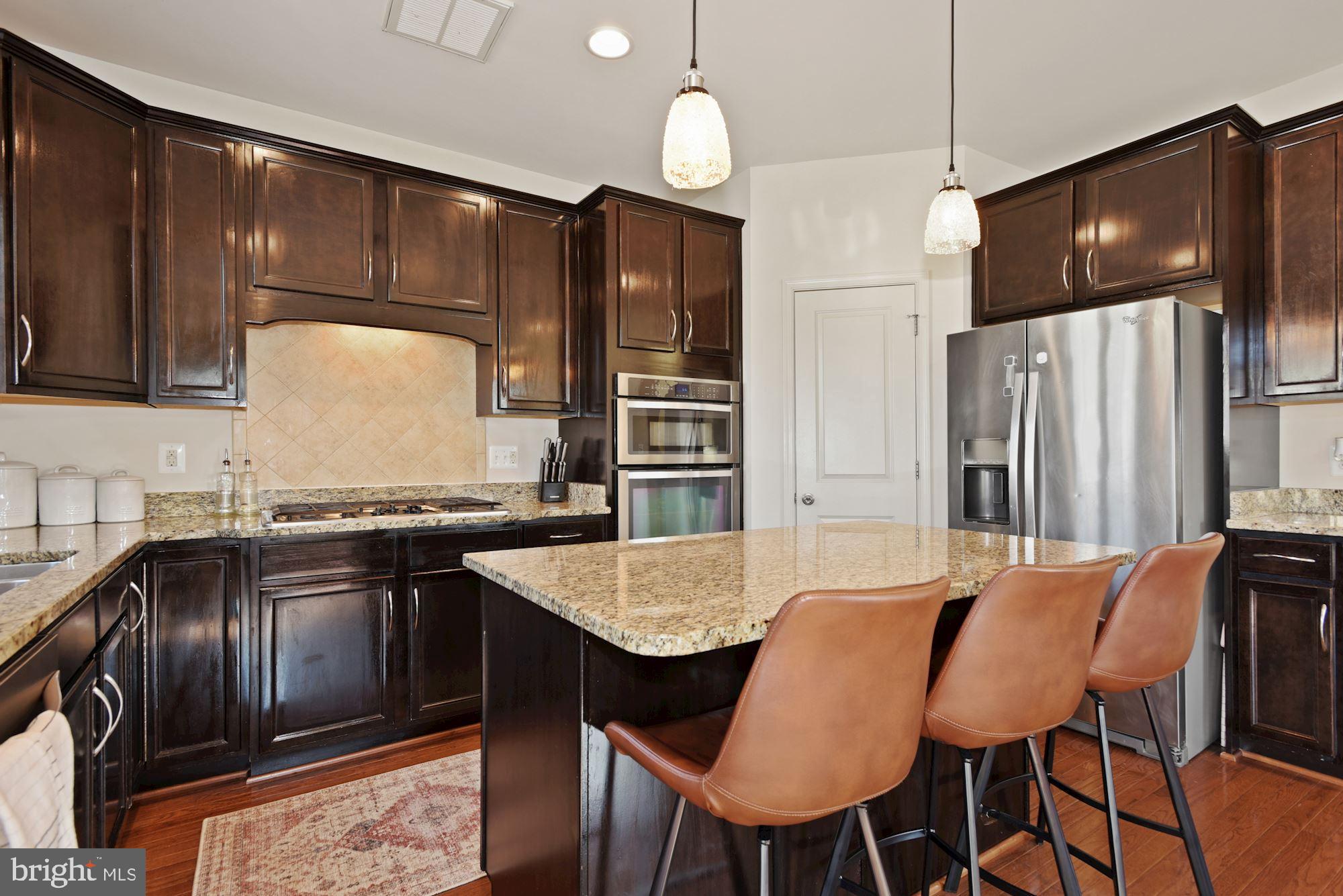 42186 Castle Ridge Square Brambleton, VA 20148 - Photo 12 of 37 Gorgeous kitchen w/ island & granite counters!