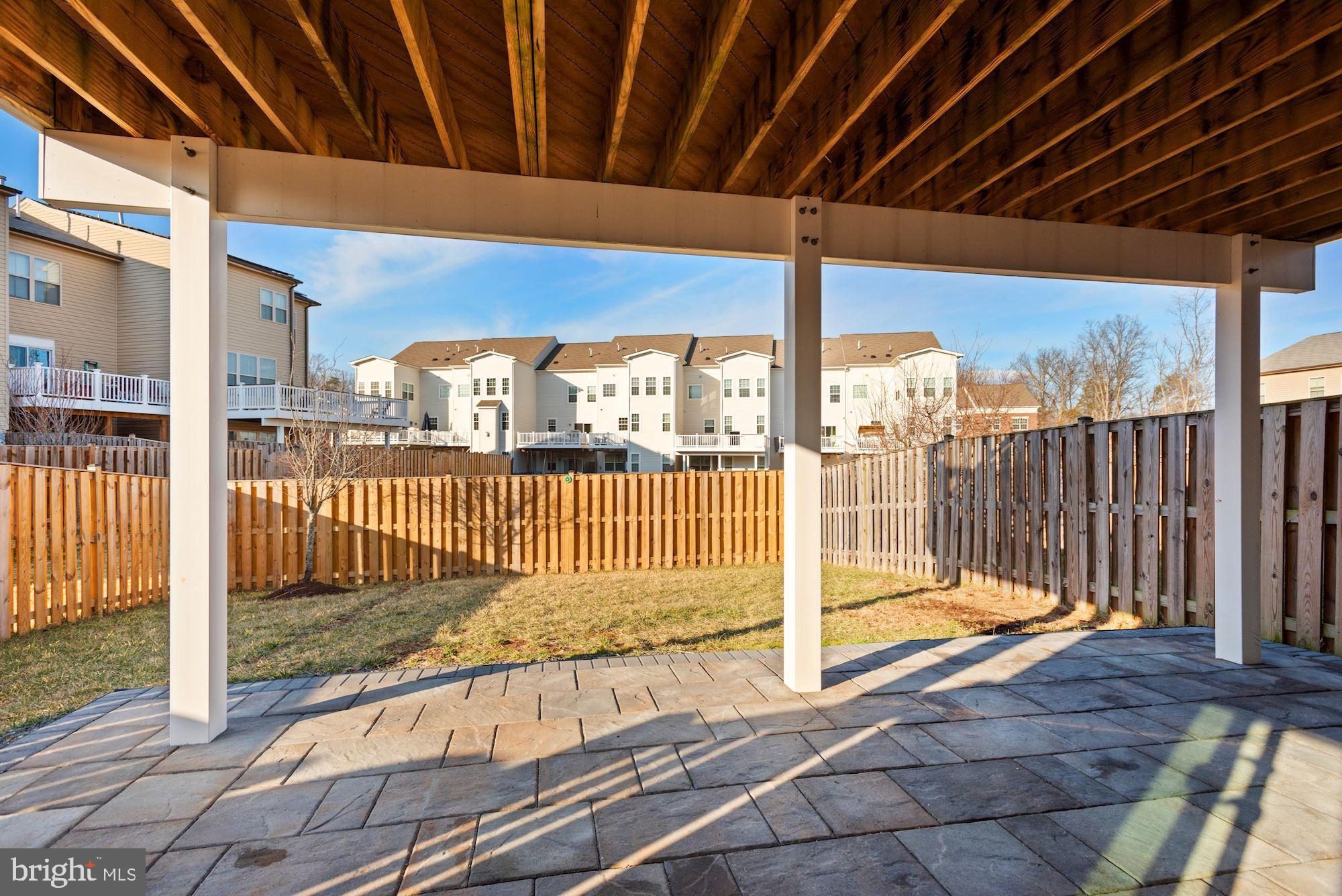 42186 Castle Ridge Square Brambleton, VA 20148 - Photo 34 of 37 Lower level patio and fenced-in backyard!