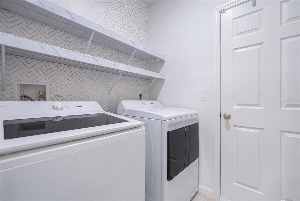 9201 Potomac Drive Fort Pierce, FL 34945 - Photo 16 of 24 a utility room with dryer and washer