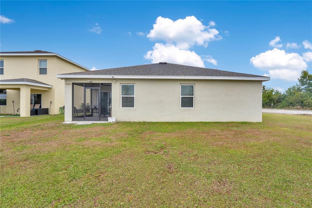 9201 Potomac Drive Fort Pierce, FL 34945 - Photo 19 of 24 a view of a house with a backyard