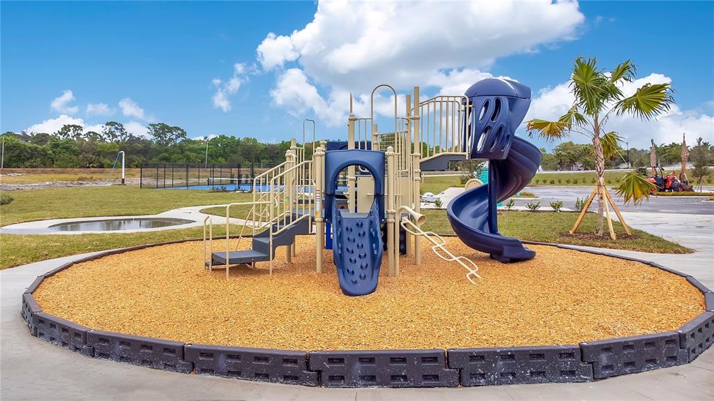 9201 Potomac Drive Fort Pierce, FL 34945 - Photo 21 of 24 a view of a swimming pool with a yard and plants