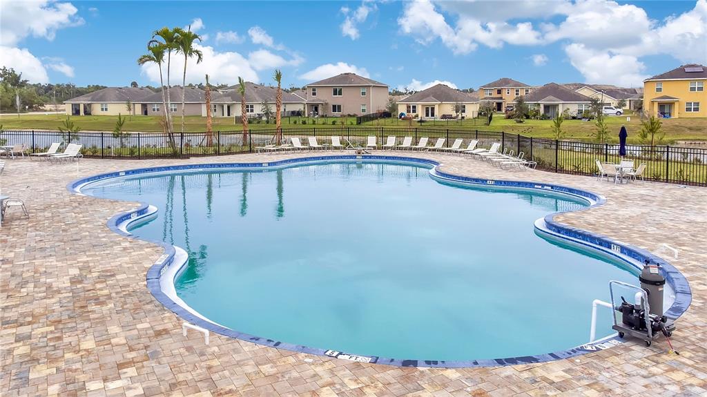 9201 Potomac Drive Fort Pierce, FL 34945 - Photo 22 of 24 a view of swimming pool with a terrace and city view