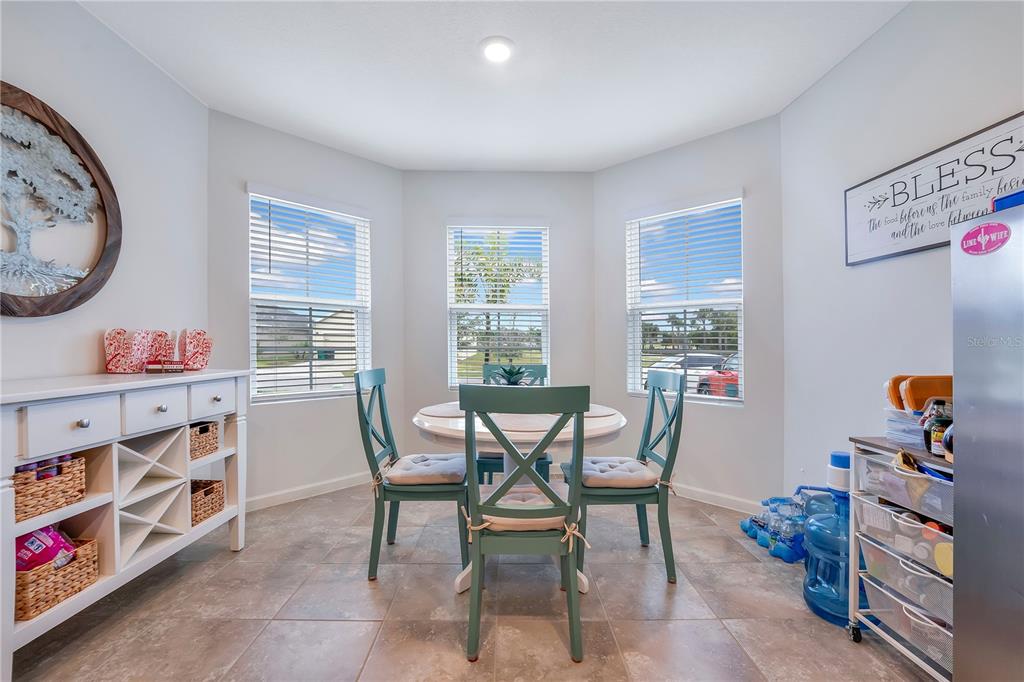 9201 Potomac Drive Fort Pierce, FL 34945 - Photo 9 of 24 a dining room with furniture and a window