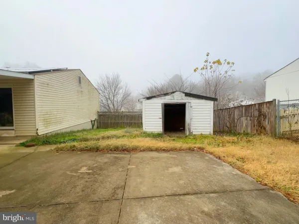 a view of garage and yard