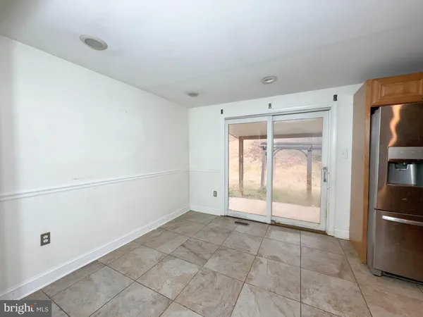 a view of an empty room and window