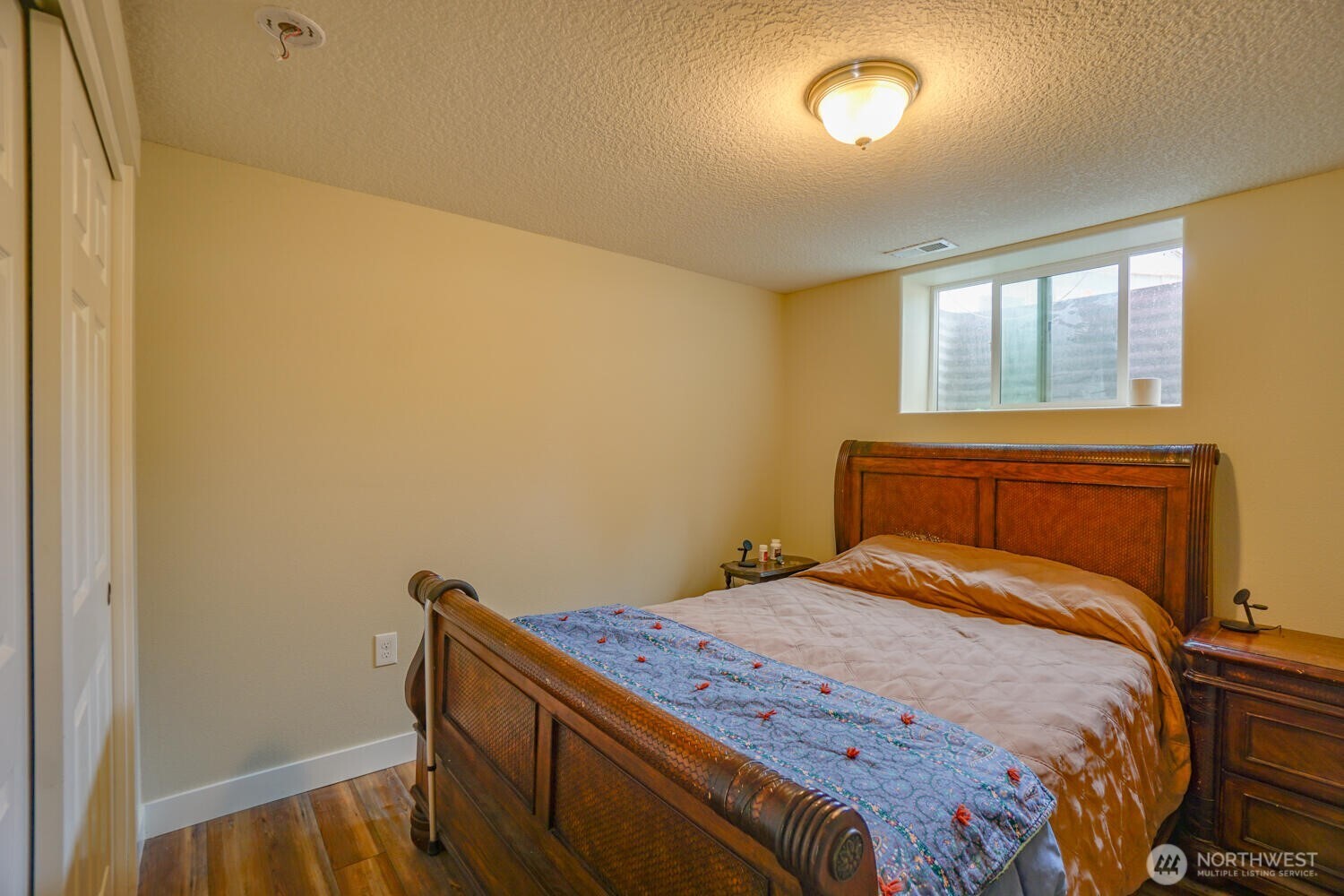 19910 Northeast 356th Street Yacolt, WA 98675 - Photo 14 of 37 a bedroom with a bed and a window