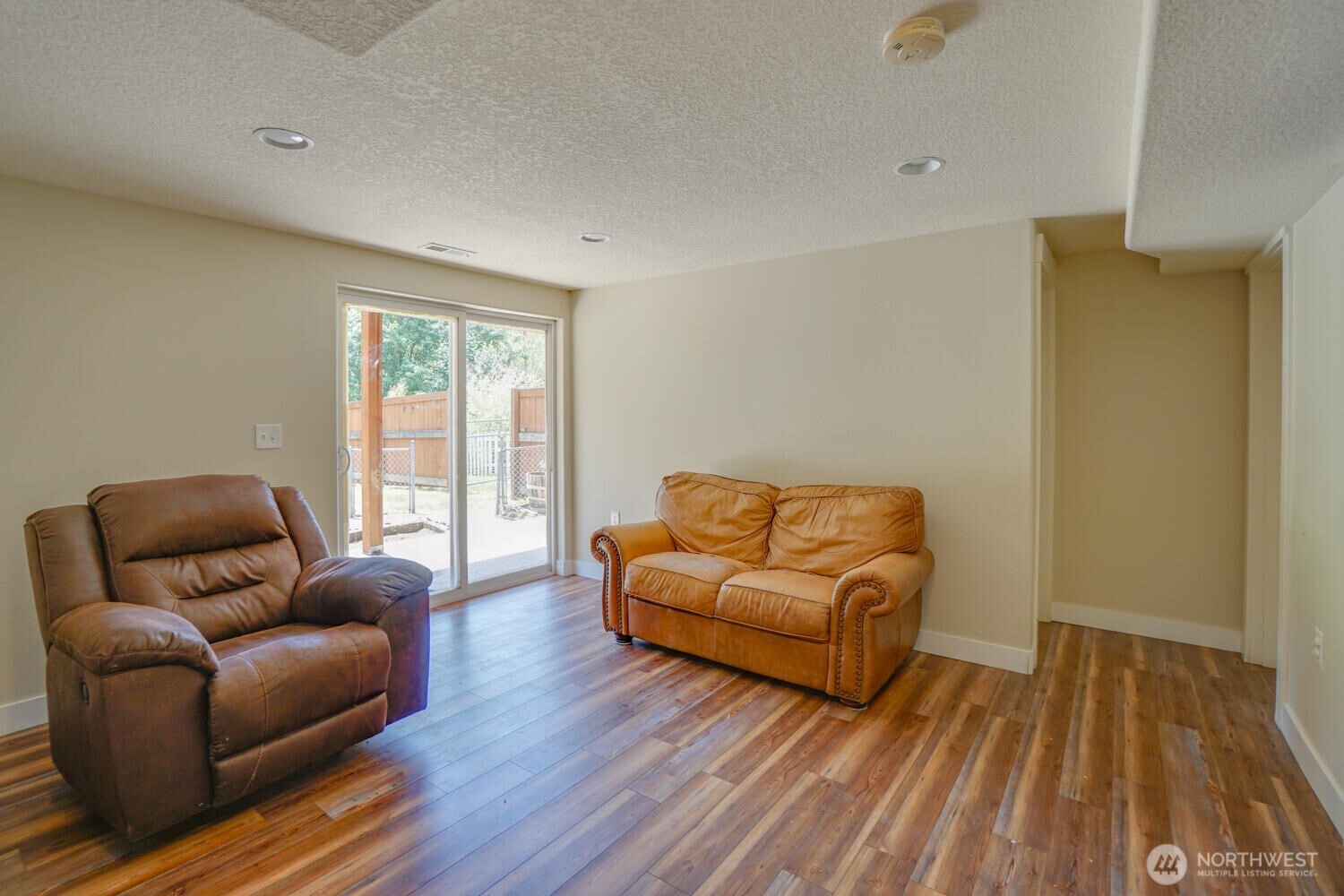 19910 Northeast 356th Street Yacolt, WA 98675 - Photo 15 of 37 a living room with furniture and a wooden floor