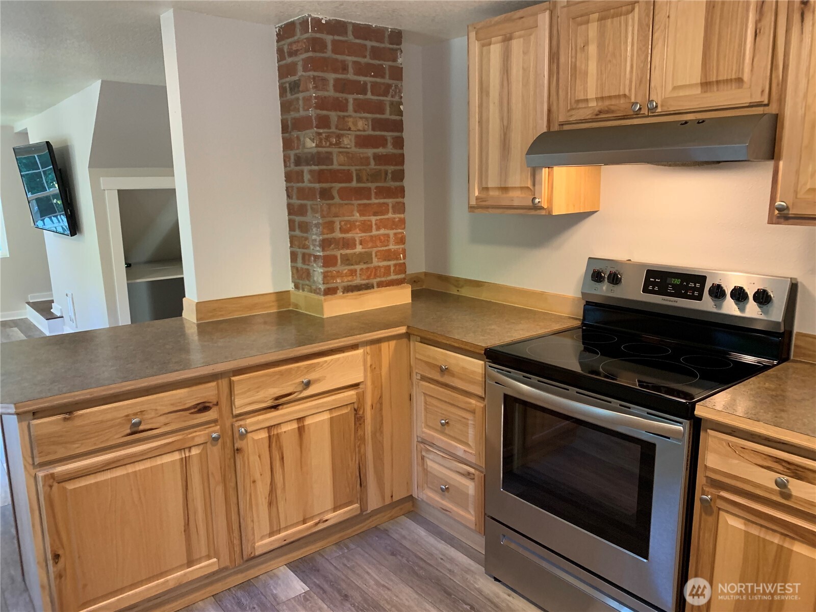 19910 Northeast 356th Street Yacolt, WA 98675 - Photo 21 of 37 a kitchen with granite countertop cabinets stainless steel appliances and a sink