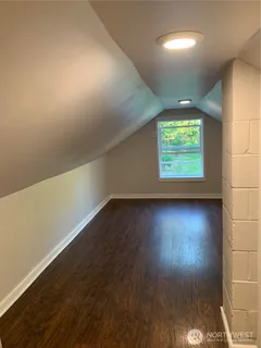 a view of a field with trees in the background