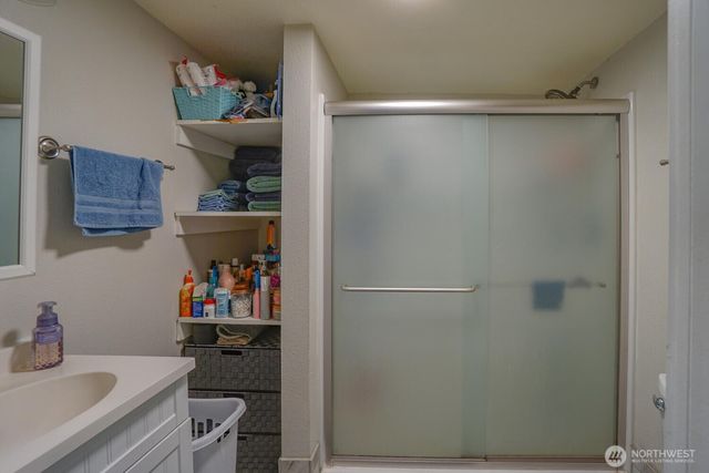 a view of a backyard with wooden fence