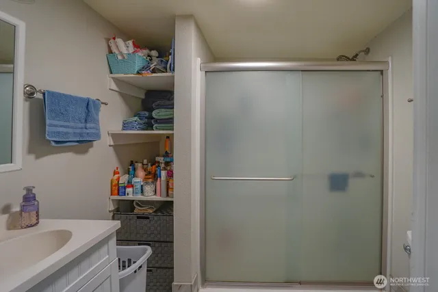 a view of a backyard with wooden fence