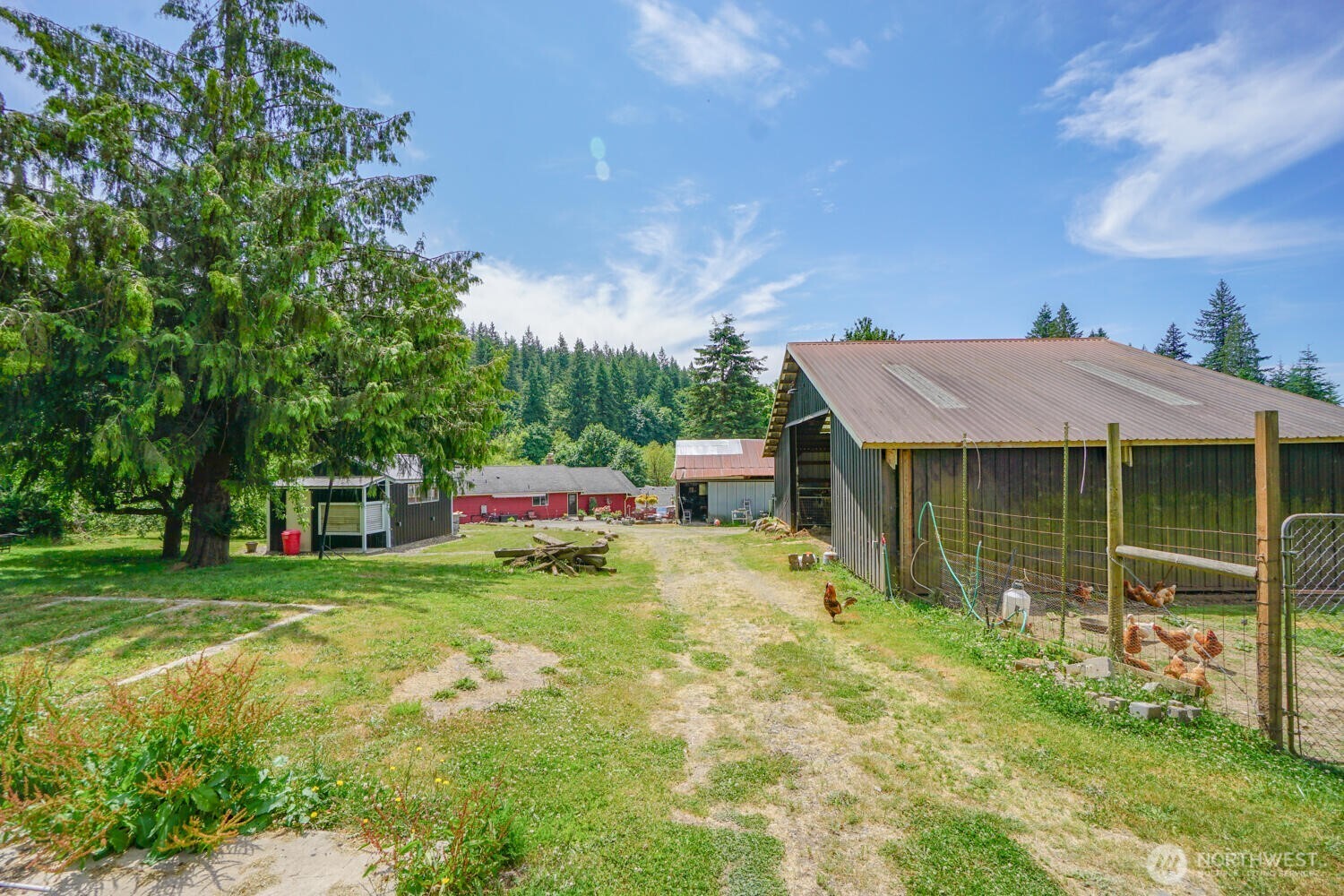 19910 Northeast 356th Street Yacolt, WA 98675 - Photo 30 of 37 a backyard of a house with table and chairs