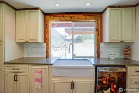a kitchen with stainless steel appliances granite countertop a sink and a cabinets