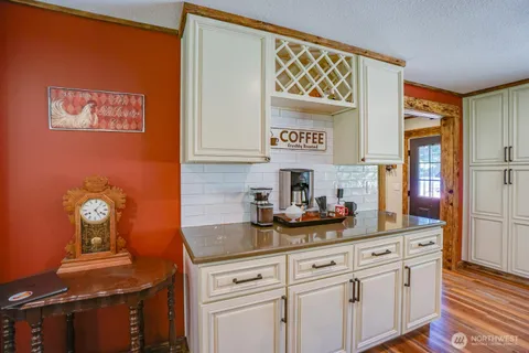 a kitchen with stainless steel appliances granite countertop a sink and cabinets