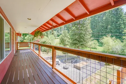a view of balcony with wooden floor