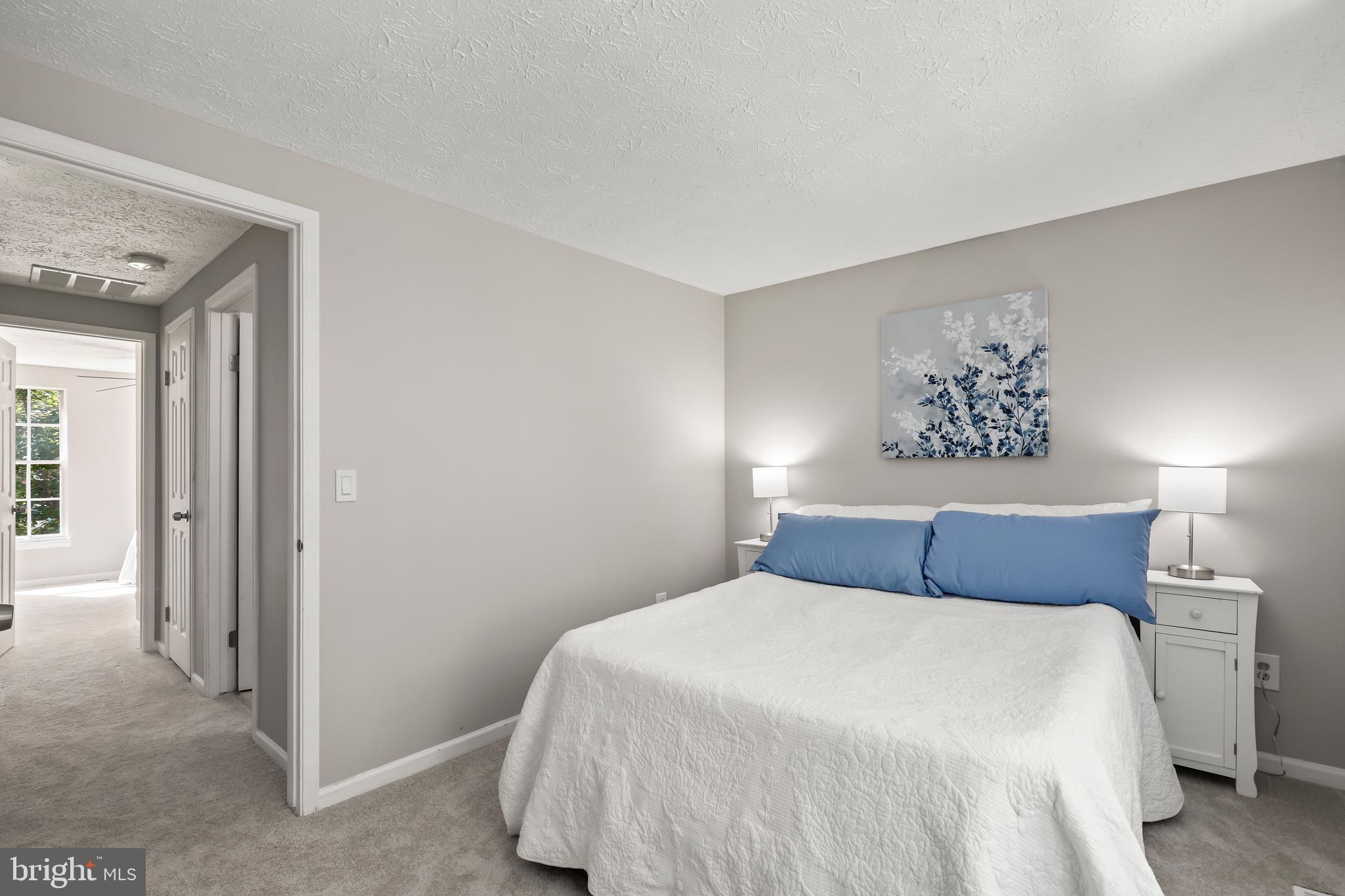 1937 Belmont Ridge Court Reston, VA 20191 - Photo 15 of 23 a bedroom with a bed and a night stand