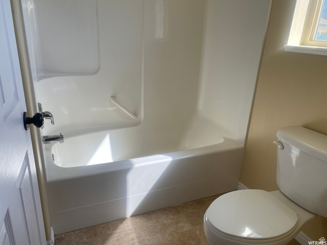 83 Canterbury Circle Logan, UT 84321 - Photo 17 of 23 Bathroom with a shower and a tub