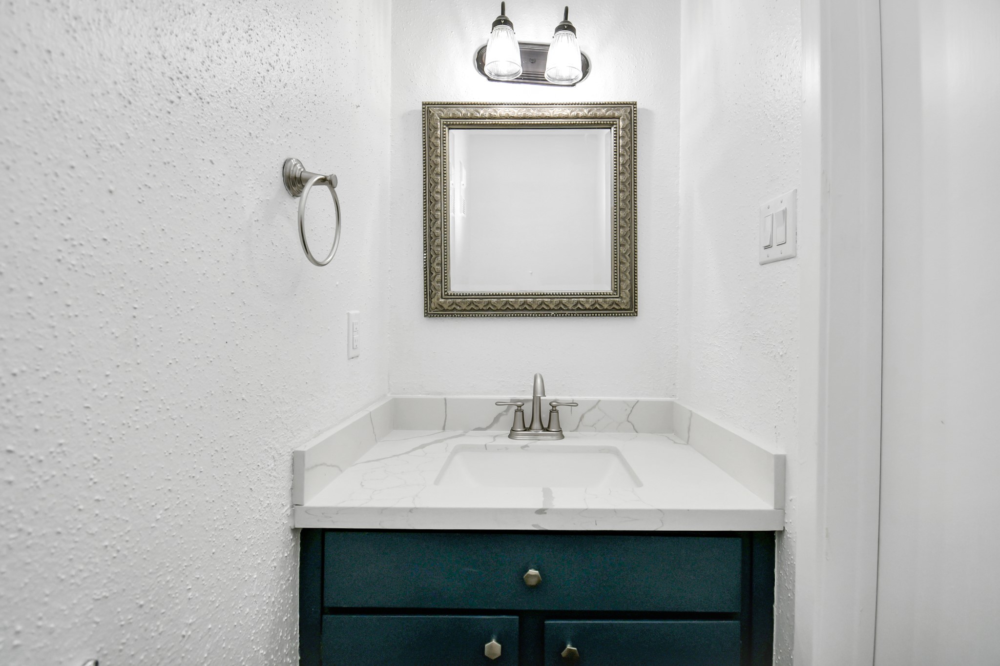 2002 Gentryside Drive, Unit 113 Houston, TX 77077 - Photo 13 of 32 a bathroom with a sink and a mirror
