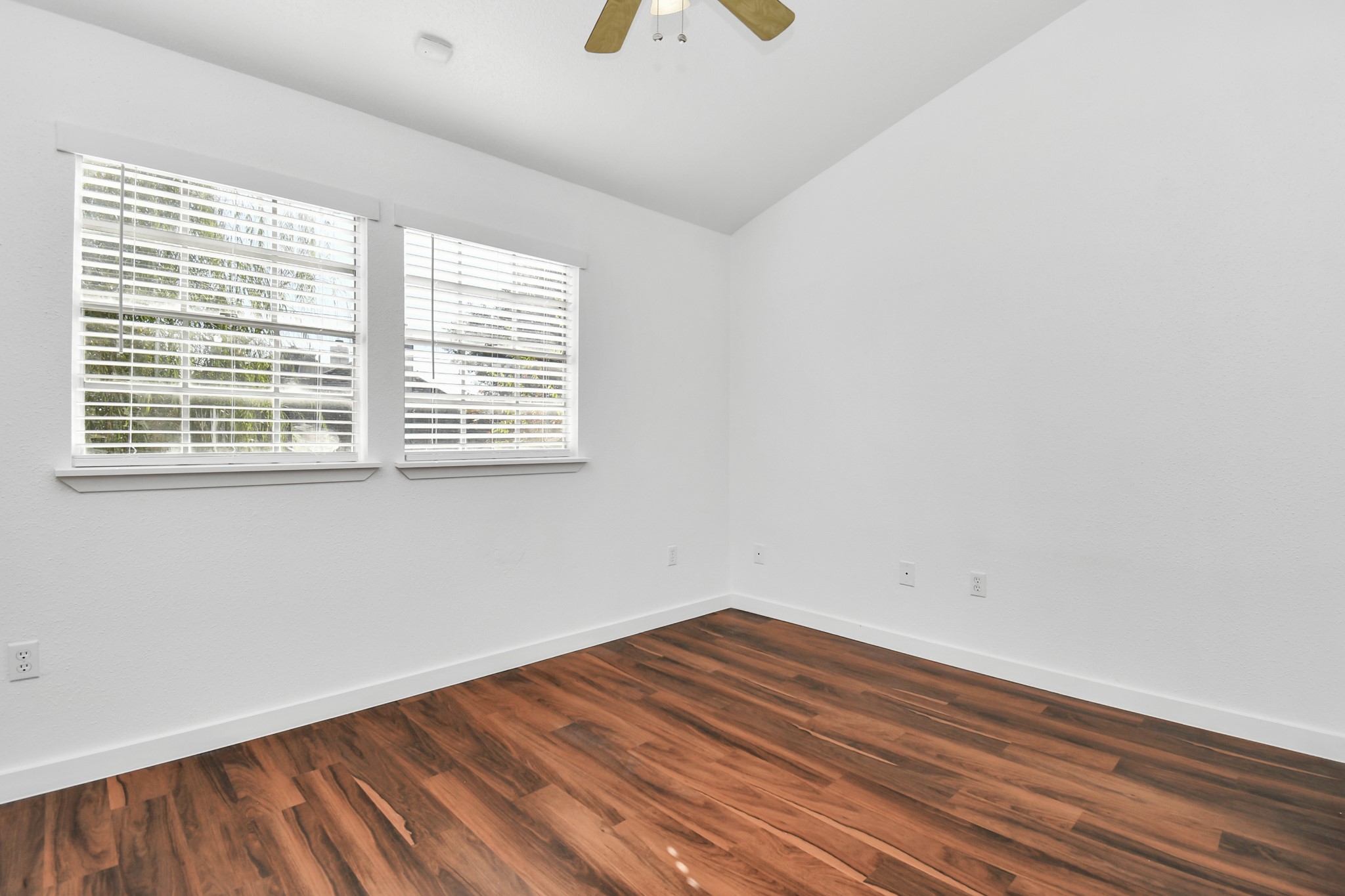 2002 Gentryside Drive, Unit 113 Houston, TX 77077 - Photo 16 of 32 wooden floor in an empty room with a window