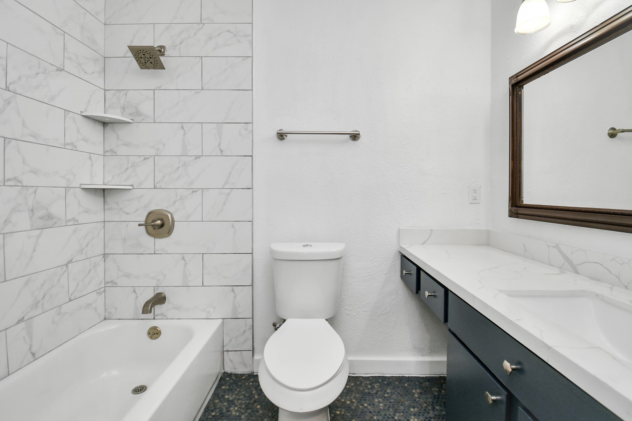 2002 Gentryside Drive, Unit 113 Houston, TX 77077 - Photo 19 of 32 a bathroom with a sink toilet and shower