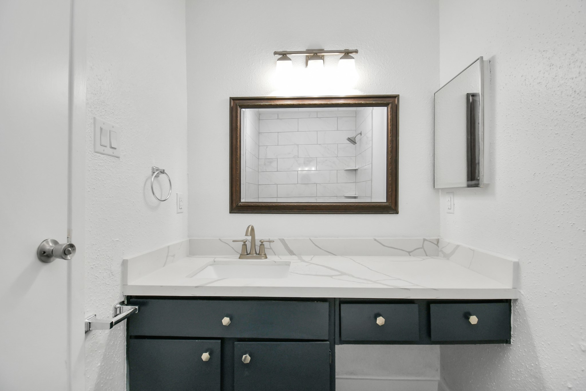 2002 Gentryside Drive, Unit 113 Houston, TX 77077 - Photo 27 of 32 a bathroom with a sink vanity and a mirror