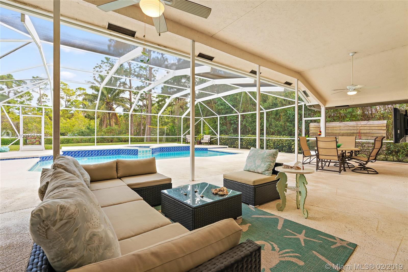 18897 Southeast Loxahatchee River Road Jupiter, FL 33458 - Photo 25 of 48 Outdoor living room in covered lanai 45ft x 33ft and screened in pool/spa area 45ft x 18ft.