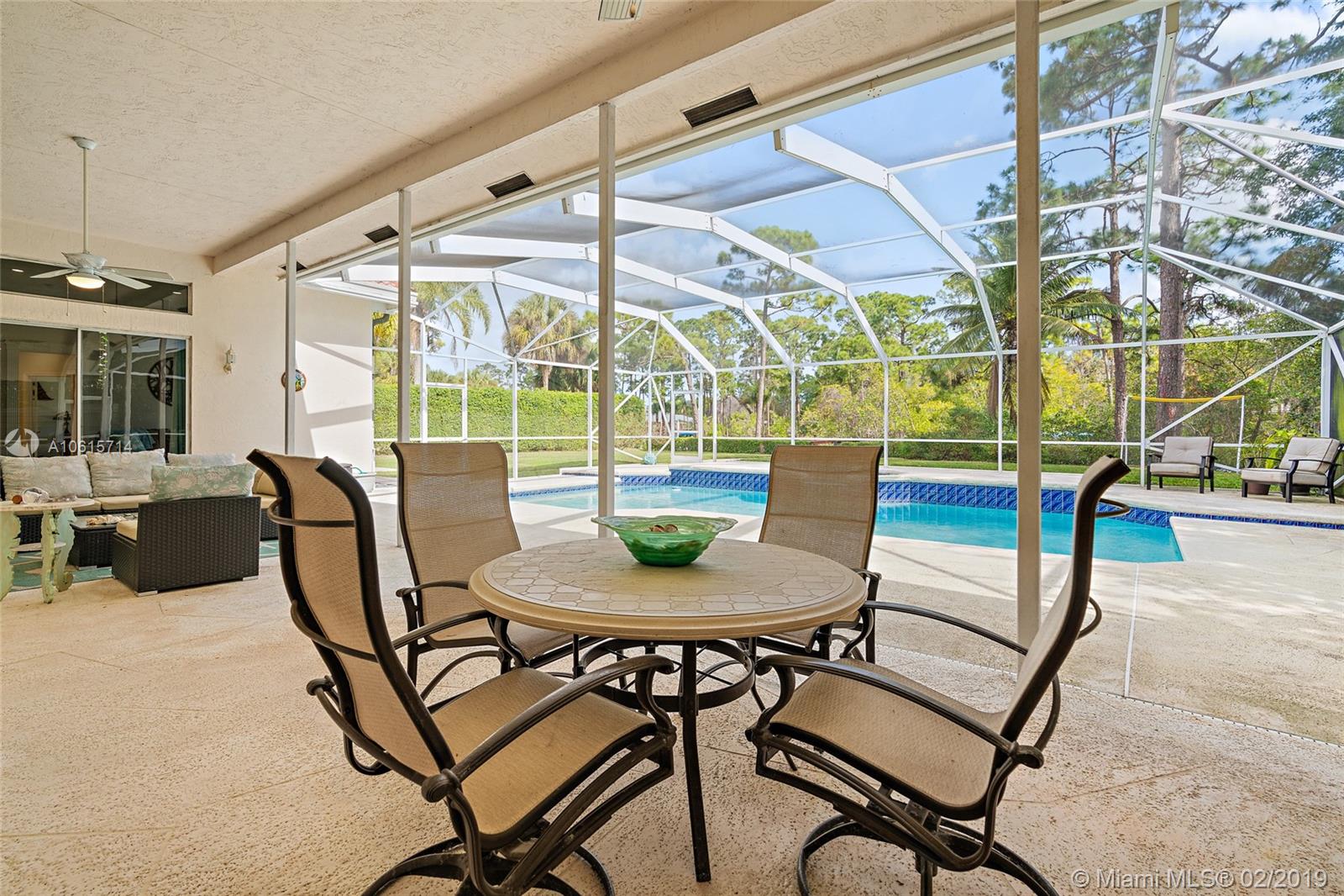18897 Southeast Loxahatchee River Road Jupiter, FL 33458 - Photo 27 of 48 Outdoor living/dining room in covered lanai 45ft x 33ft and screened in pool area 45ft x 18ft.