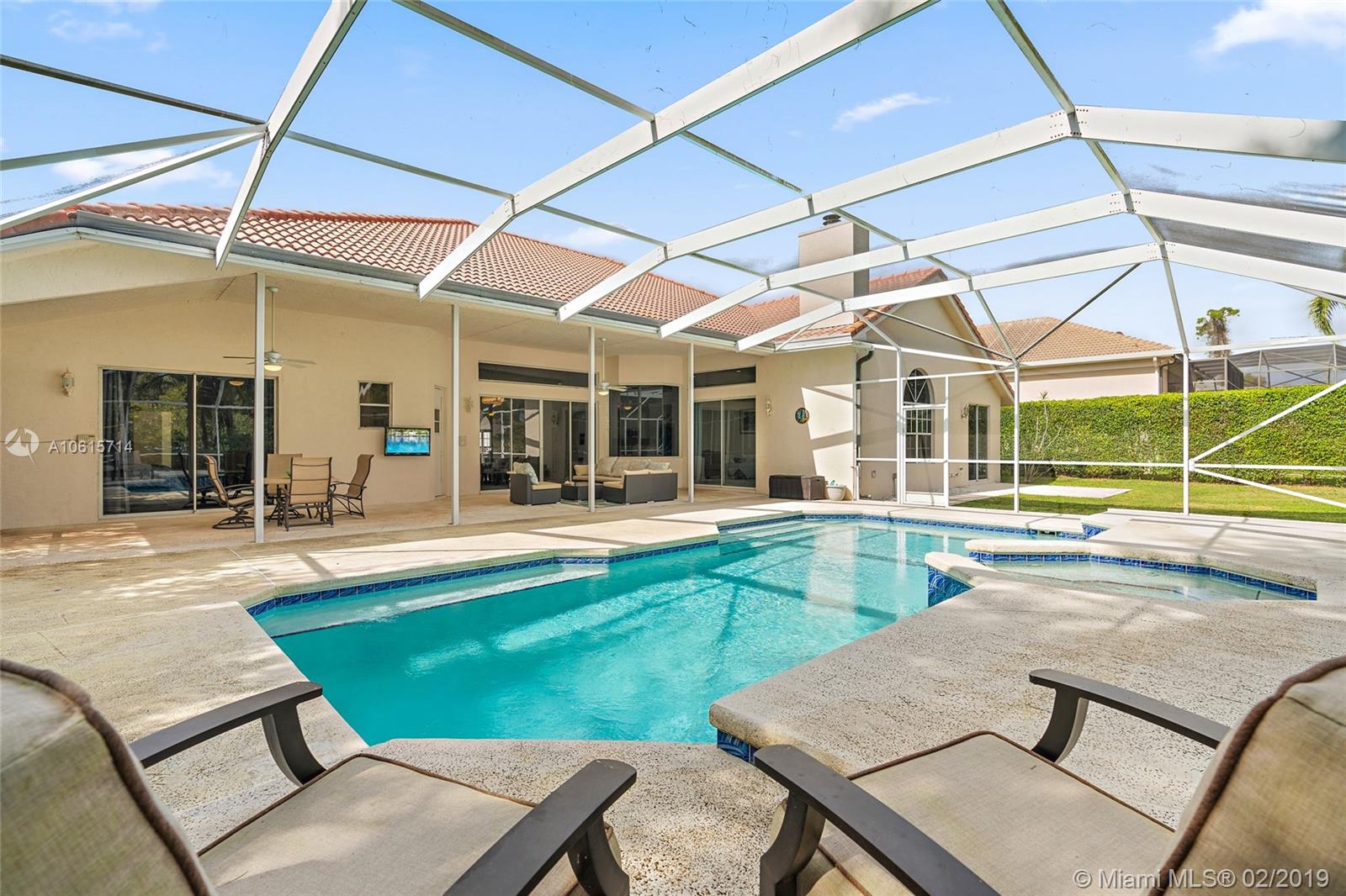 18897 Southeast Loxahatchee River Road Jupiter, FL 33458 - Photo 28 of 48 Outdoor living area in covered lanai 45ft x 33ft and screened in pool/spa area 45ft x 18ft.
