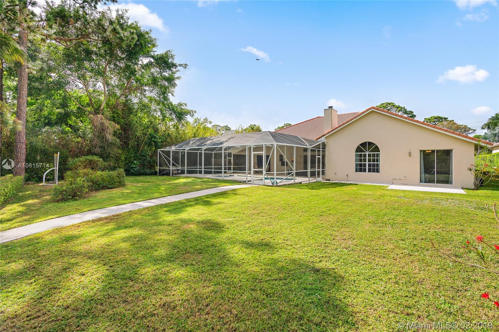 18897 Southeast Loxahatchee River Road Jupiter, FL 33458 - Photo 30 of 48 Private backyard with plenty of green space.