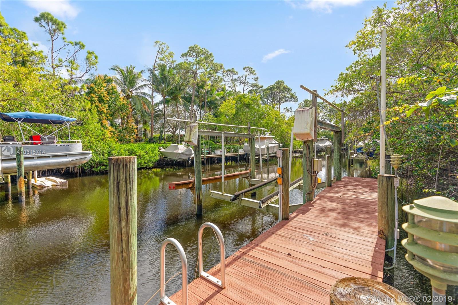 18897 Southeast Loxahatchee River Road Jupiter, FL 33458 - Photo 32 of 48 34ft private dock with boat lift. Electric and water. Deep water canal with ocean access.