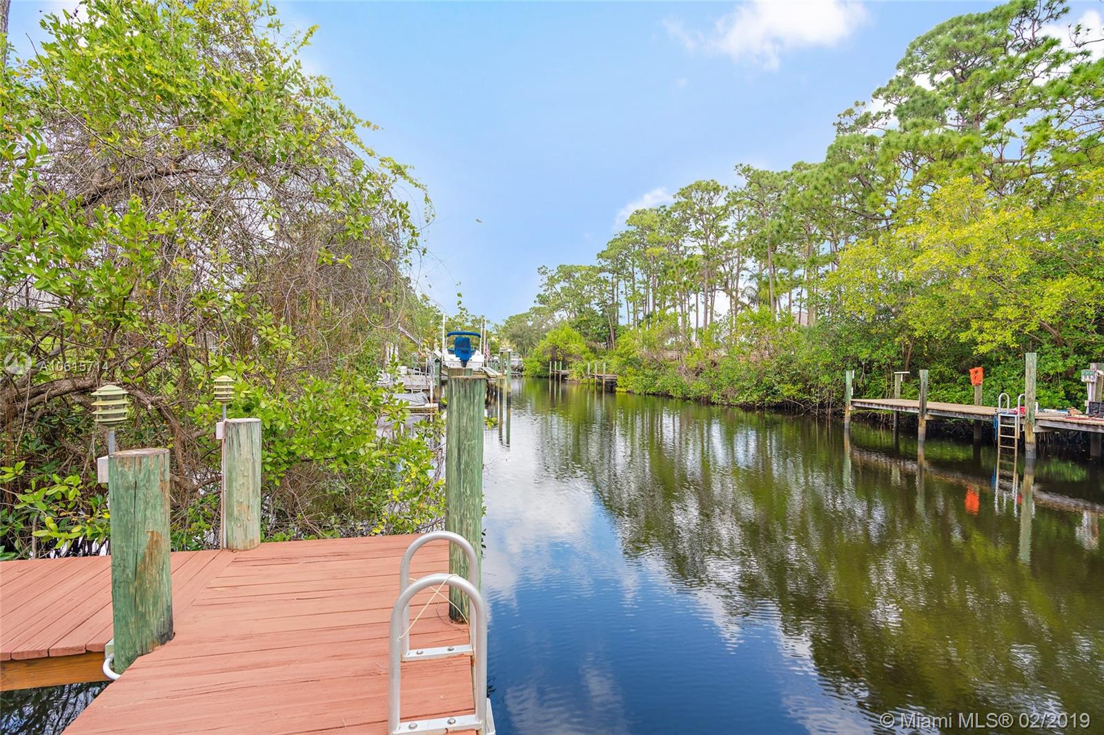 18897 Southeast Loxahatchee River Road Jupiter, FL 33458 - Photo 33 of 48 34ft private dock with boat lift. Electric and water. Deep water canal with ocean access.