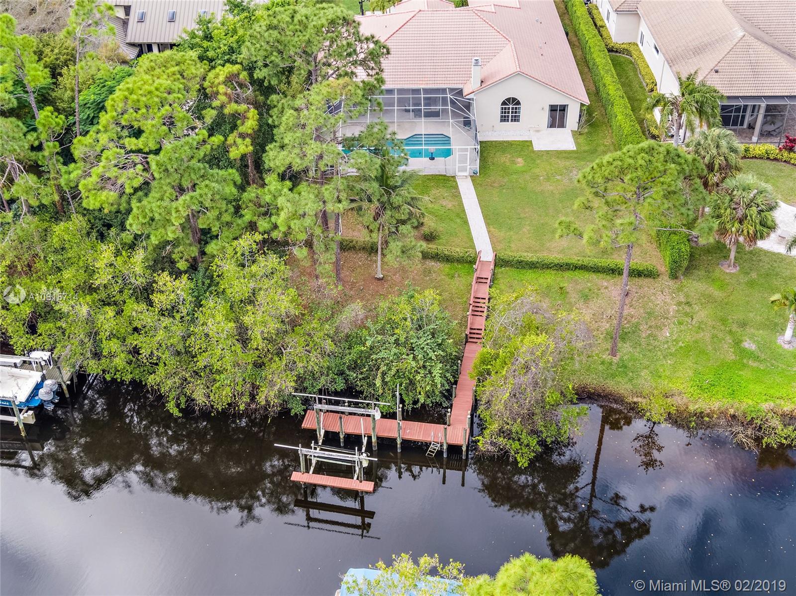 18897 Southeast Loxahatchee River Road Jupiter, FL 33458 - Photo 34 of 48 Aerial view backyard, 34ft private dock with boat lift. Electric and water. Deep water canal with ocean access.