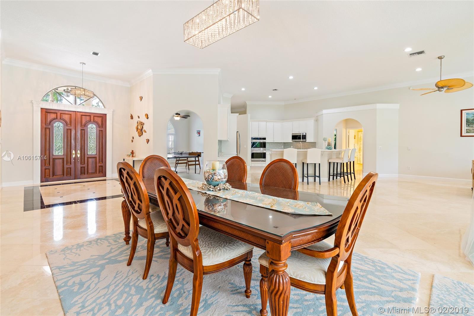 18897 Southeast Loxahatchee River Road Jupiter, FL 33458 - Photo 5 of 48 Open great room with 12ft volume ceilings and crown molding. Formal living room area currently used as dining room.