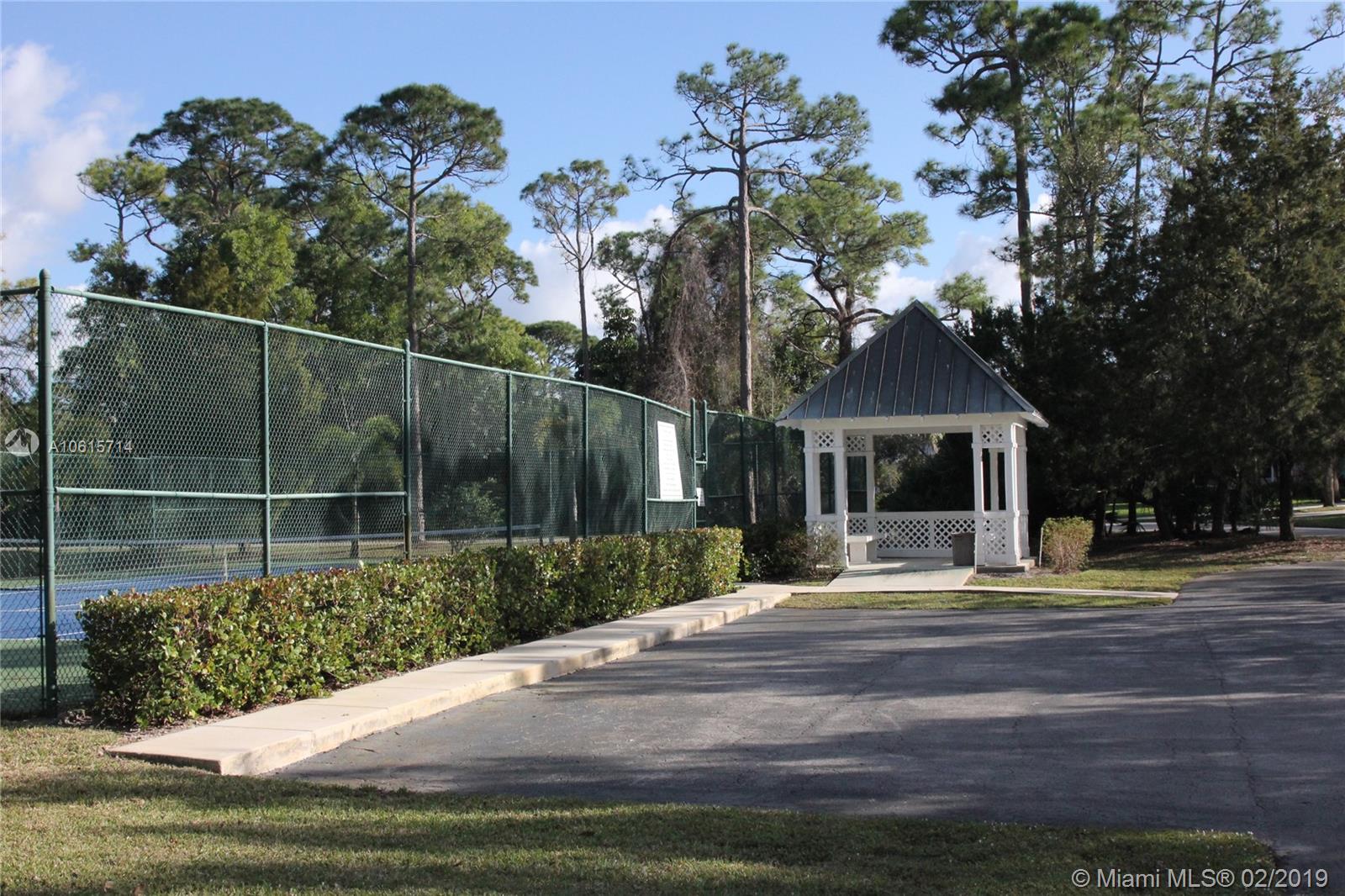 18897 Southeast Loxahatchee River Road Jupiter, FL 33458 - Photo 41 of 48 Community tennis court and gazebo.