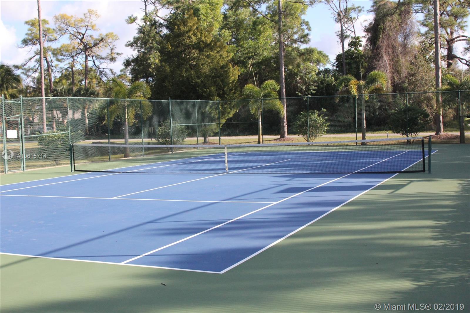 18897 Southeast Loxahatchee River Road Jupiter, FL 33458 - Photo 44 of 48 Community tennis court and gazebo.