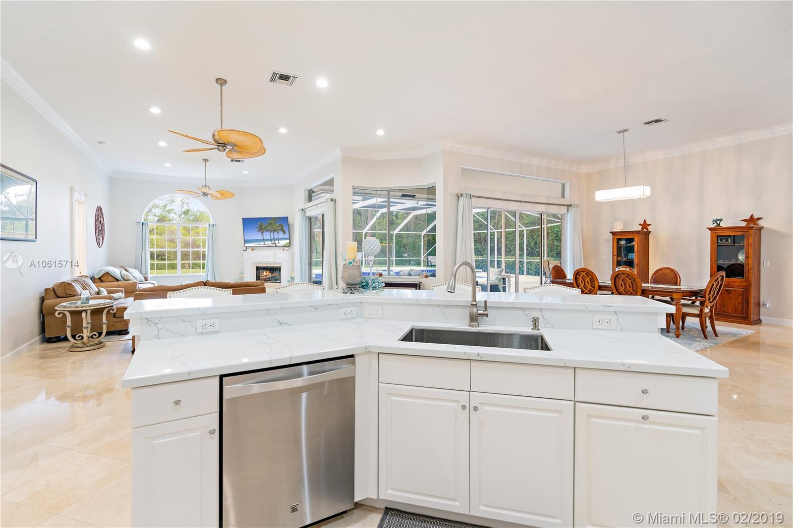 18897 Southeast Loxahatchee River Road Jupiter, FL 33458 - Photo 10 of 48 View from kitchen of family room, dining room. Lots of light and windows.