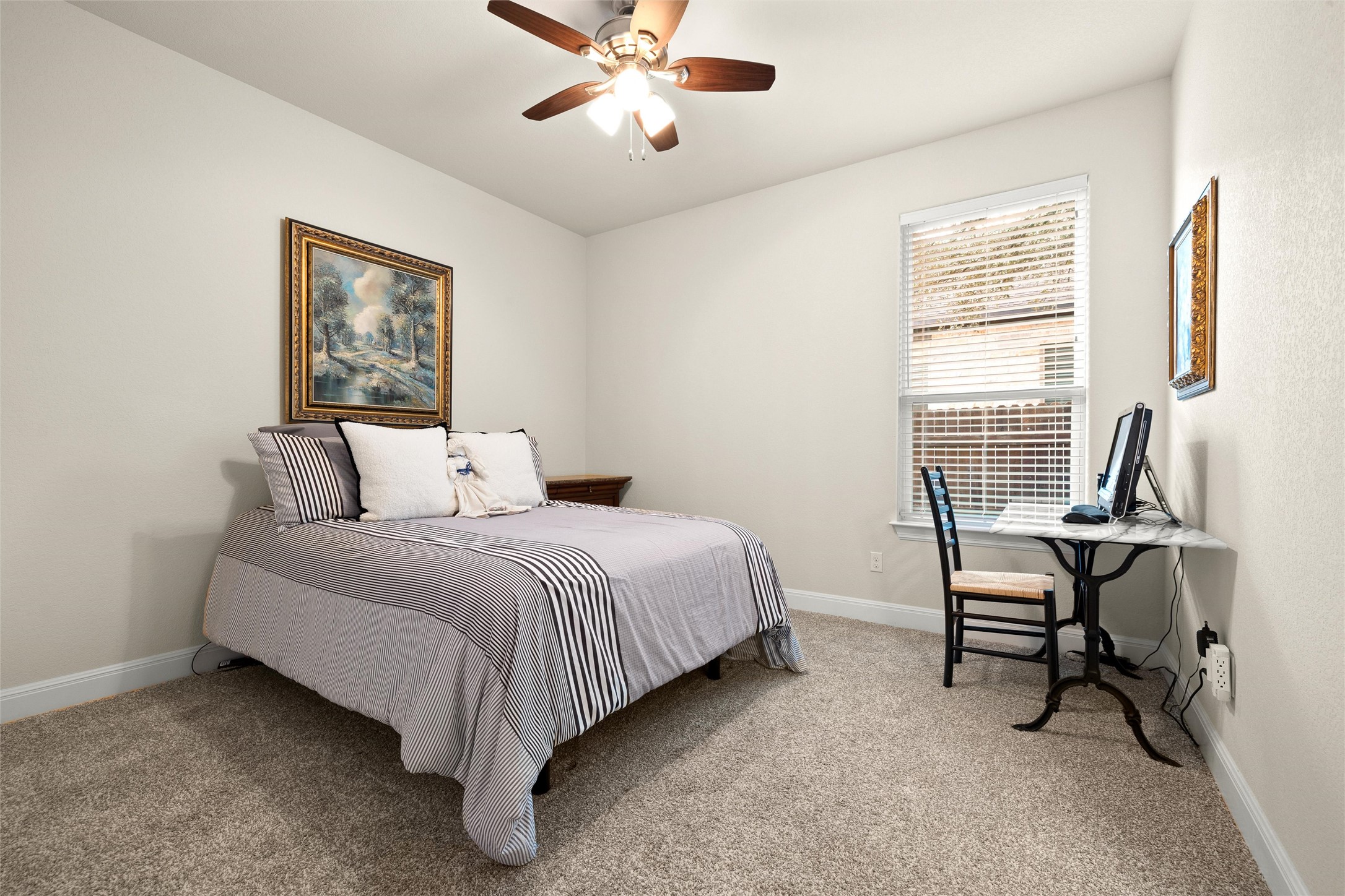 479 Crosswater Lane Dripping Springs, TX 78620 - Photo 24 of 40 a bedroom with a bed and a window