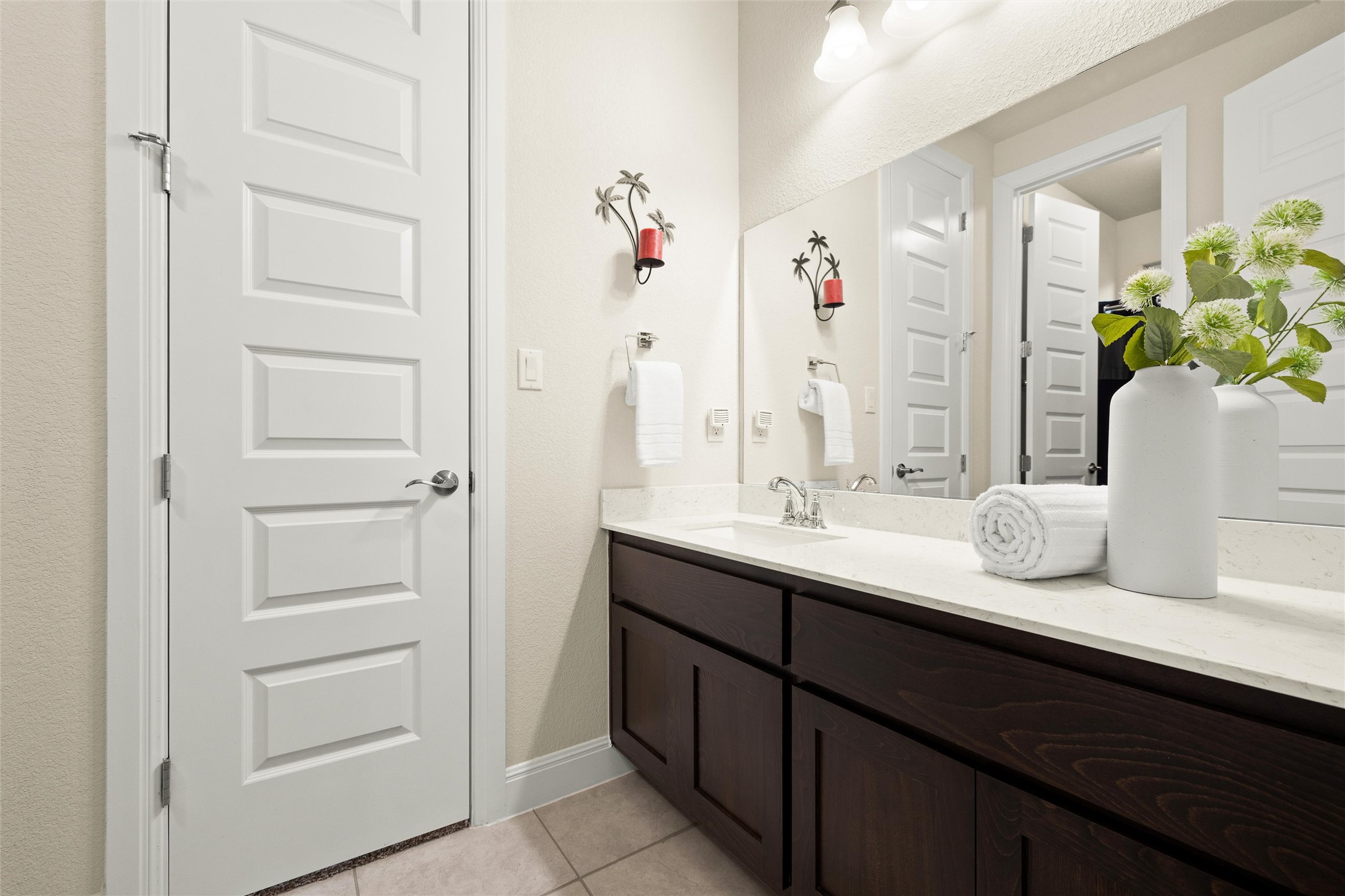 479 Crosswater Lane Dripping Springs, TX 78620 - Photo 25 of 40 a bathroom with a double vanity sink a vanity and a potted plant