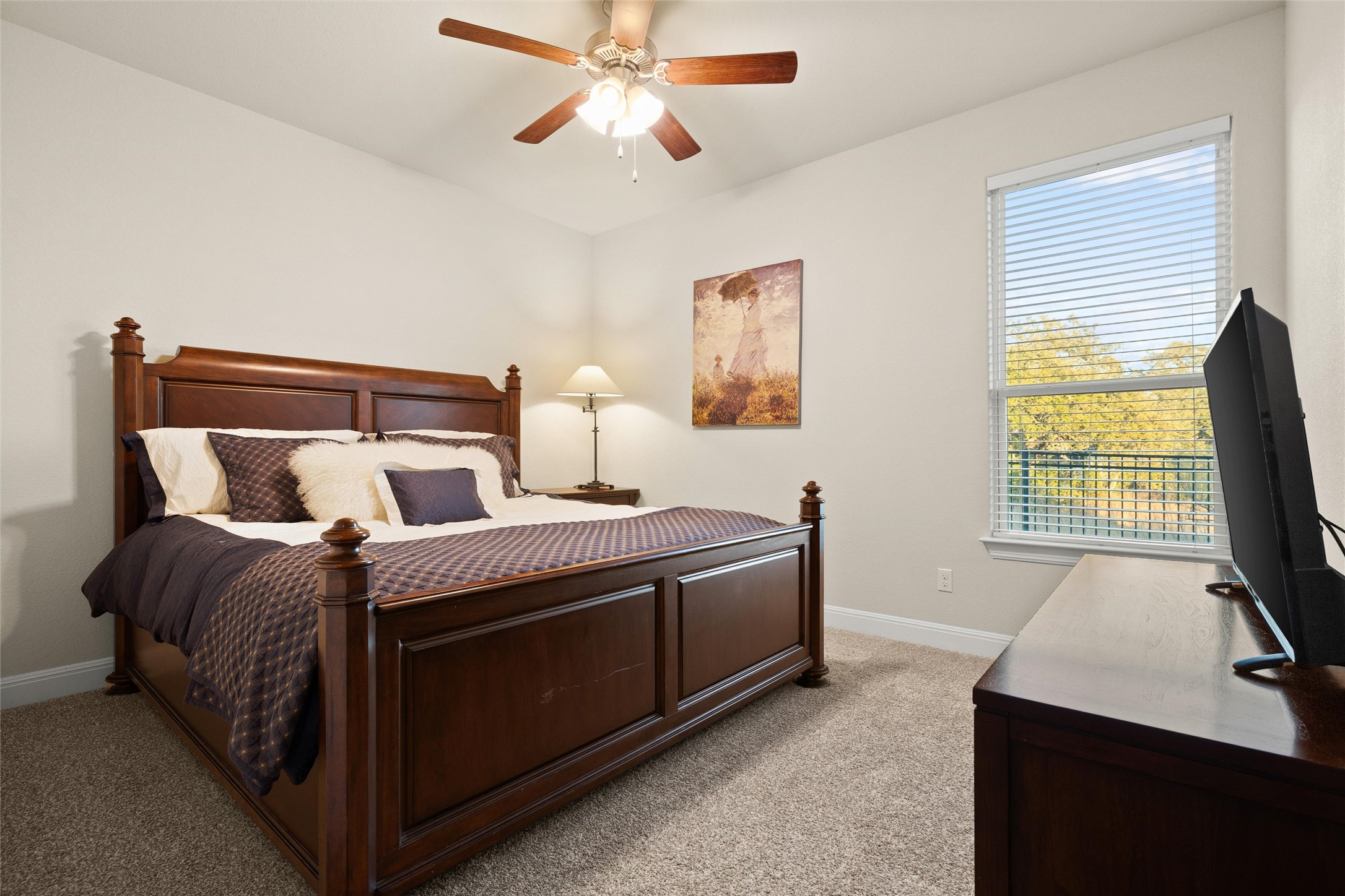479 Crosswater Lane Dripping Springs, TX 78620 - Photo 27 of 40 a spacious bedroom with a bed and a window