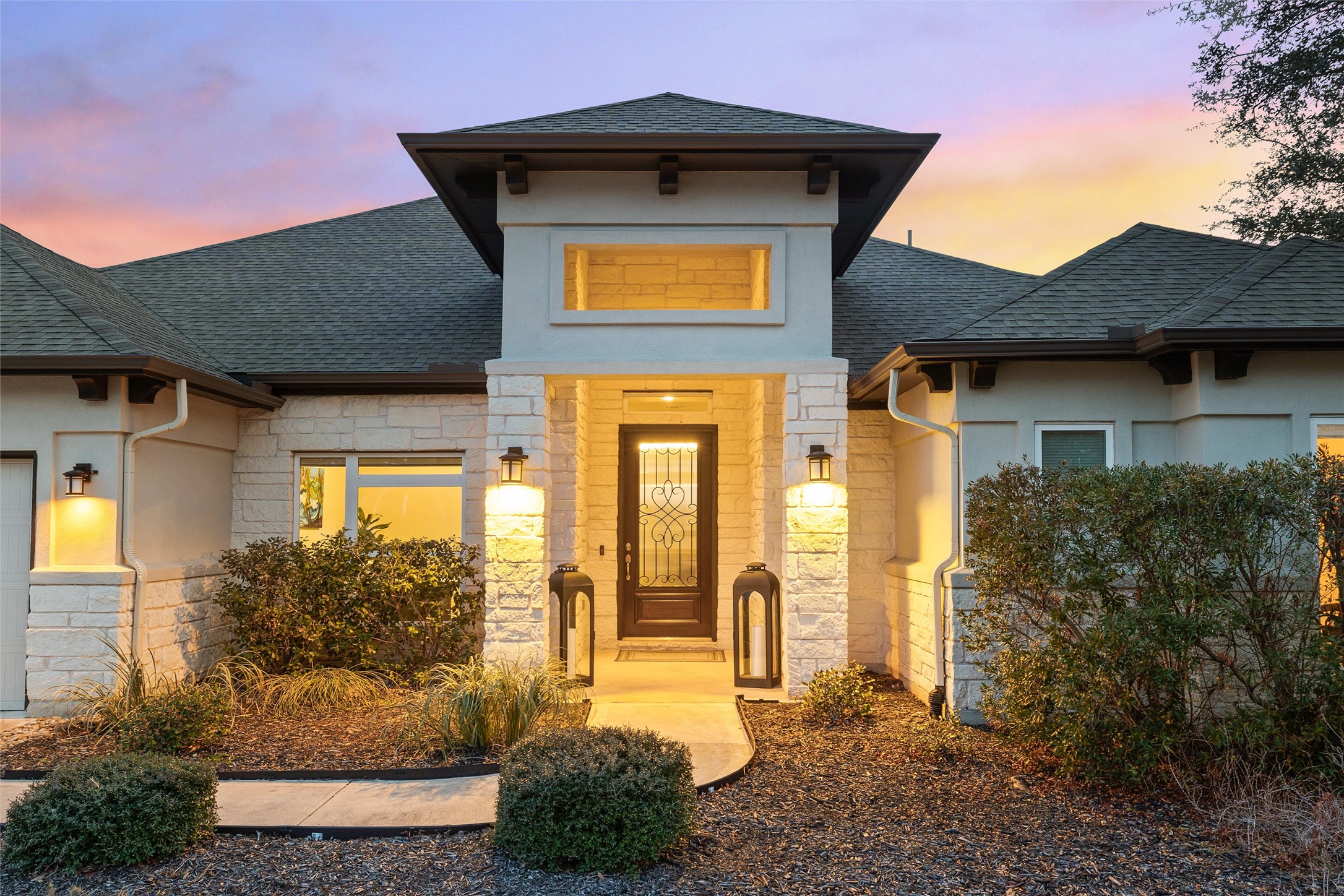 479 Crosswater Lane Dripping Springs, TX 78620 - Photo 4 of 40 a front view of a house with a yard