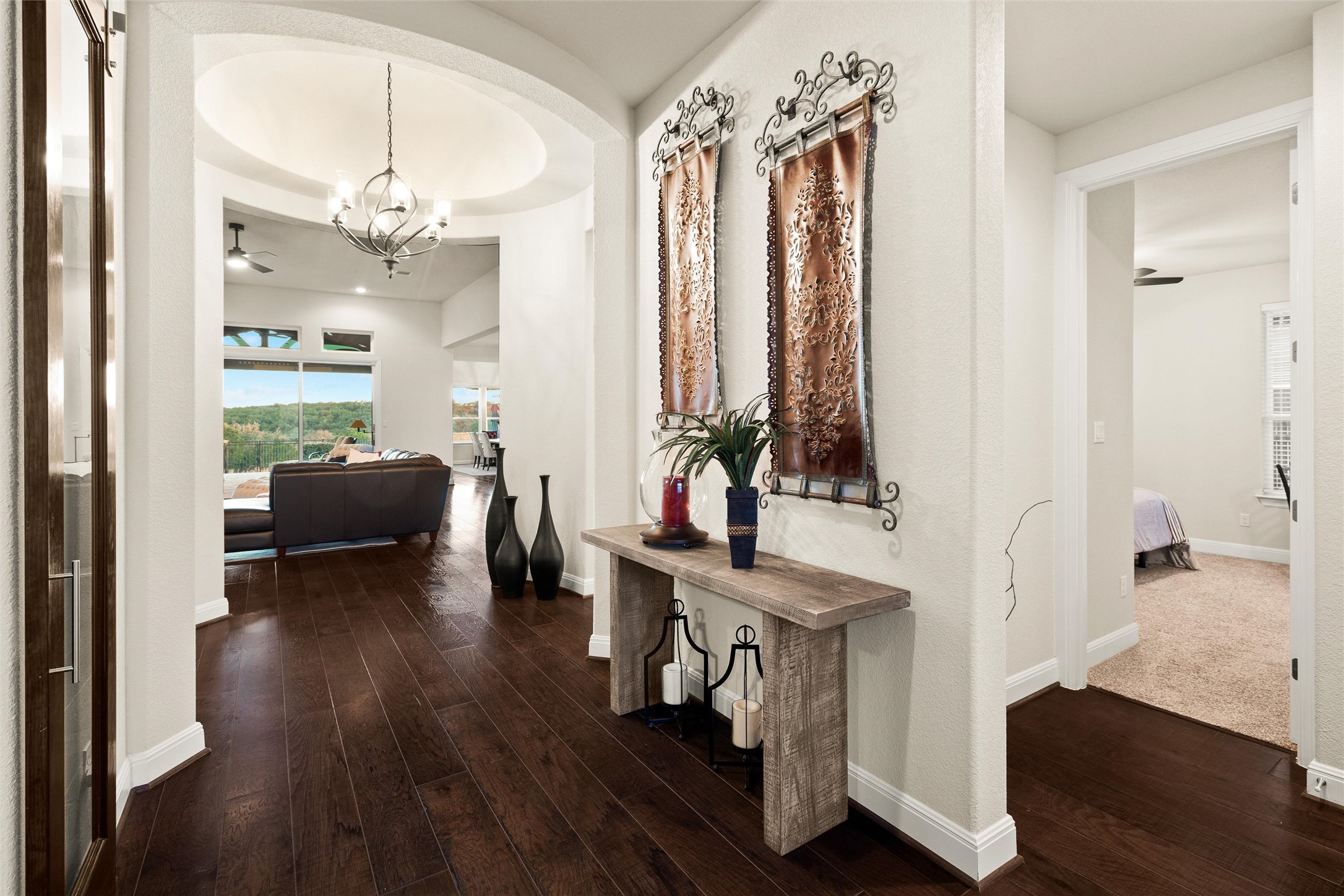 479 Crosswater Lane Dripping Springs, TX 78620 - Photo 7 of 40 a living room with furniture and a chandelier