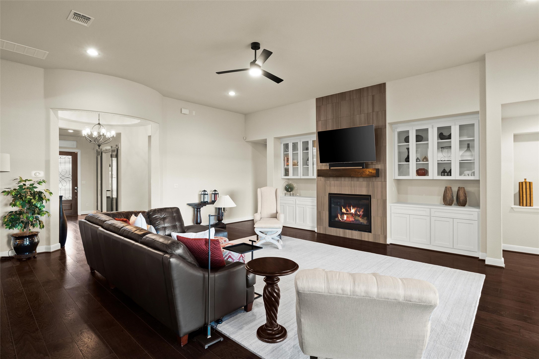 479 Crosswater Lane Dripping Springs, TX 78620 - Photo 8 of 40 a living room with furniture and a fireplace